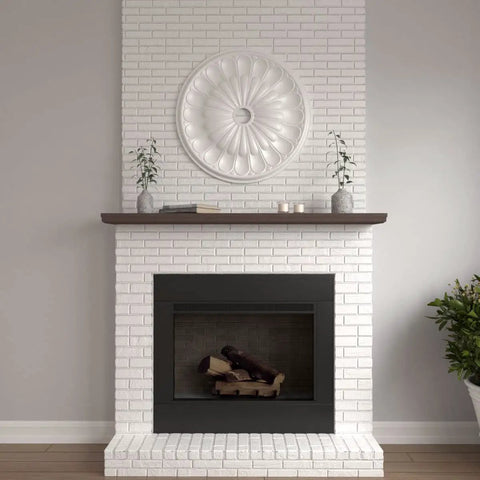 Ceiling Medallion With Thirty One And Five Eighths Inch Outside Diameter And Three And Five Eighths Inch Inner Diameter Fits Canopies Up To Three And Five Eighths Inches Lightweight Easy Install With Common Tools Exquisite Detailing Factory Primed shown on a white brick wall above a fireplace.