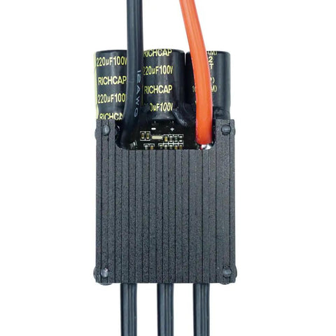 Close-up of Dope 50A Mini FSESC 4.20 Electric Skateboard Speed Controller with aluminum heat sink and wires visible.