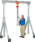 Portable Adjustable Height Aluminum Gantry Crane Lightweight Workshop Hoist With No Fuss Setup Easy Lift Gear Without Breakin Sweat For Tight Garage Bays, with user demonstrating hoist operation.