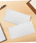 White Self Sealing Envelopes 100 Pack With Peel And Seal Flap For Biz Mail And Legal Documents Great For Office Supplies Receipts And Everyday Mailing Release Paper Inside on wooden desk