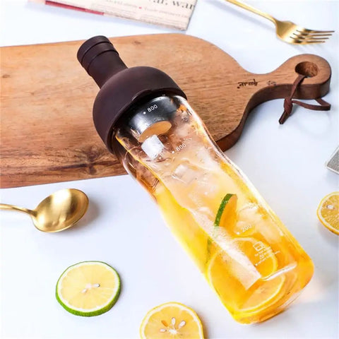 This Straight Up Game Changing 800 Ml Cold Brew Coffee Maker Doubles As A Portable Iced Espresso Glass Bottle With Leakproof Tea Infuser Designed For Boss Level Chilled Sips Anywhere You Head, showing iced tea with citrus slices.