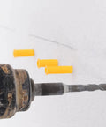 Drill creating hole for Heavy Duty Yellow Self Drilling Wall Expansion Anchor Kit, 200 Pack For Hollow Walls, Durable Plastic Drywall Anchors