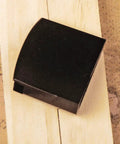 Sturdy Brass Habaki Collar Clip For Katana And Japanese Swords Locks Tsuba In Place And Keeps Your Saya Secure on wood background