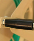 Close-up of the crank handle of the Built Tough Heavy Duty Steel Garden Hose Reel Wall And Floor Mount, tan finish.