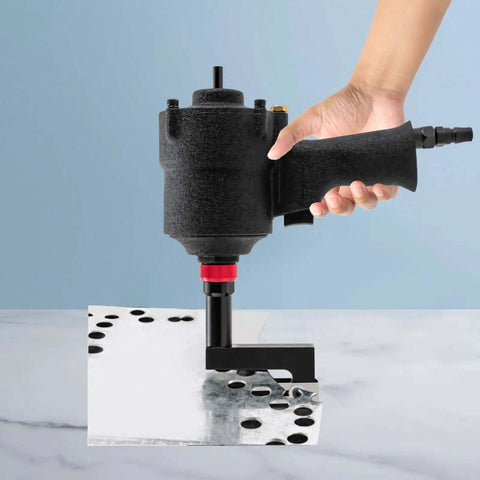 Pro Grade 8mm Pneumatic Hole Puncher in use, punching precise 0.08 inch holes in metal sheet, held by hand, showcasing durable design.