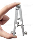 Hand holding metal Pro Grade Watch Spring Bar Plier Tool Kit With Tweezers And 10 Replacement Pins For Link Removal And Band Repair