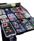 Professional Industrial Flatbed Inkjet Printer Delivers Crisp Serial Number Labeling With Plug And Play Ease For Chemical Packaging No Sweat Smudgeproof Auto Coding Rig showcasing colorful phone cases.