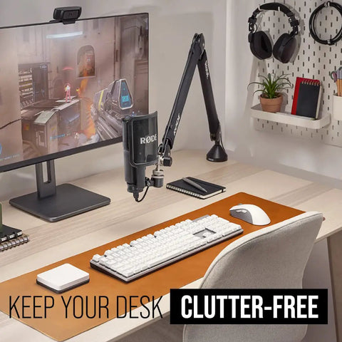 Modern desk setup with PSA1+ Pro Studio Desk Boom Arm with spring damping, cable management, and 360 degree rotation in black.