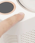 User pressing button on Great Slick And Totally Nifty Mini Countertop Ice Maker With 12V Car Adapter.