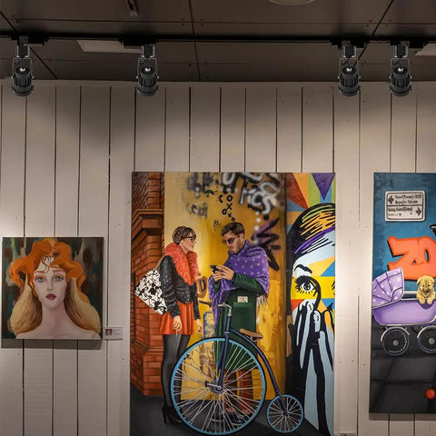 12W RGBW Track Light Heads 6 Pack With 16 Color Options illuminating artwork on H type rail in gallery