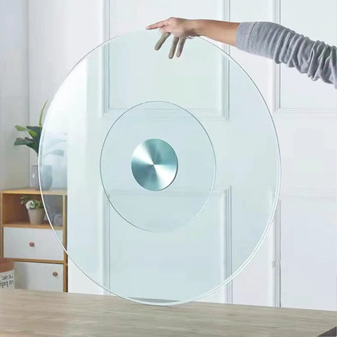 Twenty Seven Inch Tempered Glass Lazy Susan Round Kitchen Turntable held by hand, showcasing its clear design and smooth swivel.