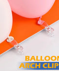 Clear Balloon Arch Clips 30 Pack, 2 Inch Plastic Backdrop Clamps securing pink balloons on orange backdrop