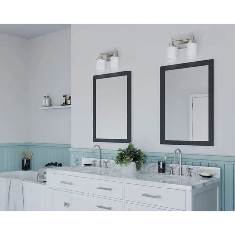 Alexa Collection 2 Light Bath Vanity Light With Dope Etched Linen Glass shown above dual mirrors in bathroom setting.