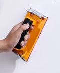Hand holding Two Pack Sandpaper Holder With Sponge Grip For 9 By 3.6 Inch Wet Dry Sheets, Durable Hand Sander Block With Strong Bite Spring