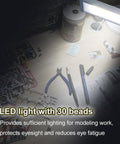 Dope Portable Gundam Model Building Workbench With LED Light And Magnifying Glass Pro Grade Tool showing tools on surface