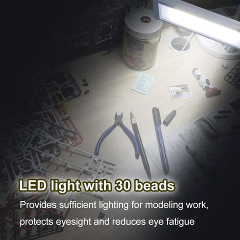 Dope Portable Gundam Model Building Workbench With LED Light And Magnifying Glass Pro Grade Tool showing tools on surface