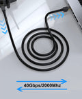 Coiled Beefy Cat8 Shielded Ethernet Cable 50 Ft Indoor Outdoor Direct Burial 26AWG SFTP Patch Cord connected to a laptop