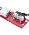 Close-up of a red circuit board from the 6 Pcs 3D Printer Endstop Mechanical Limit Switch Kit for RAMPS 1.4 With 27 Inch Cable