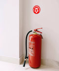 Installed Set Of 5 Fire Extinguisher Signs 4 Point 5 Inch Circle Waterproof Laminated Vinyl Stickers on wall above extinguisher.