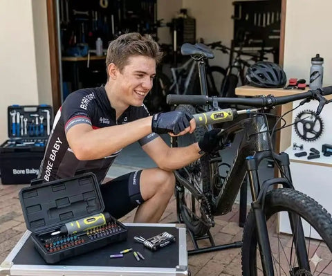 Cyclist using Pro Grade Torque Wrench And Screwdriver Set With 40 S2 Bits for bike repairs in garage