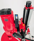 Straight Shooting Heavy Duty Workhorse Diamond Coring Drill With Tilting Rolling Base And Killer 12 Piece Wet Core Bit Set Pro Concrete Cutting Setup 110 Volt Dual Speed 2600 Watt Motor Crushes 12 Inch Cuts close-up of drill motor and tilt mechanism
