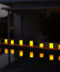 Lit Outdoor Solar Pillar Candles 3x6 Inches Waterproof Rechargeable Flameless Flickering Lights With Dusk To Dawn Sensor along a pool edge