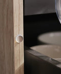Clear Silicone Cabinet Door Bumper applied to wooden cabinet edge, part of 300 Pieces Clear Silicone Cabinet Door Bumpers With Super Tacky Self Adhesive Back Anti Slam Furniture Pads For Drawers And Furniture Easy Peasy Install Guaranteed Zero Slams Forever.