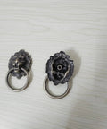 Front view of Antique Bronze Lion Head Ring Pull Cabinet Handles Set Of 4 With Screws, 2.6 Inches Long, on a light background.