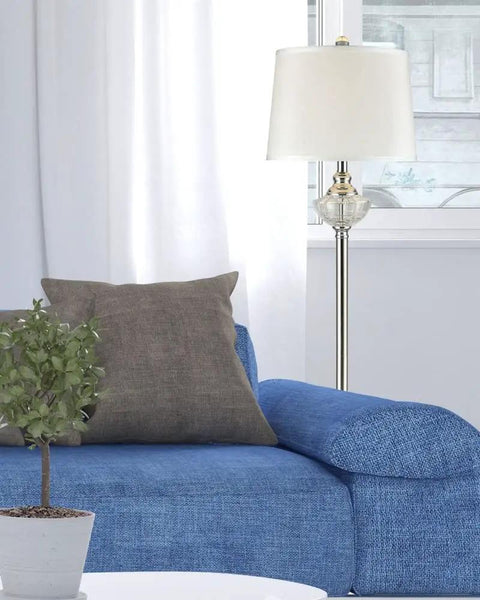 Leyla 58 Inch Crystal Floor Lamp With Metal Base And Fabric Shade next to blue couch, modern sparkle and style accent lighting.