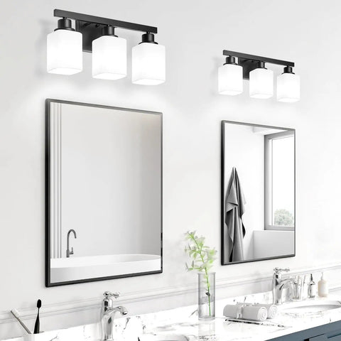 Straight Up Solid 3 Light Bathroom Vanity Lights With Square Frosted Glass Shades Matte Black Wall Sconces with mirrors in modern bathroom.