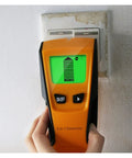 Hardcore Wireless Wall Scanner And Stud Finder With Straight Shooting Depth Detection displays detection screen near electrical outlet.