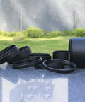 Stackable M48X0.75mm Extension Tubes Set for Cameras and Telescopes Aluminum Black Finish outdoors on concrete surface