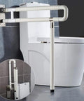 Folding Toilet Grab Bar With 180 Degree Flip Up Design No Slip Shower Hand Rail installed beside a toilet in a bathroom.