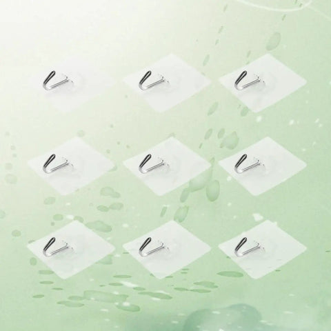 Heavy Duty Self Adhesive Hooks 50 Pack Waterproof Shower Wall Mounts No Drill Damage Free Reusable Utility Holders That Stick Like Crazy And Keep Things Tidy Without The Hassle shown in a cluster on a smooth surface.