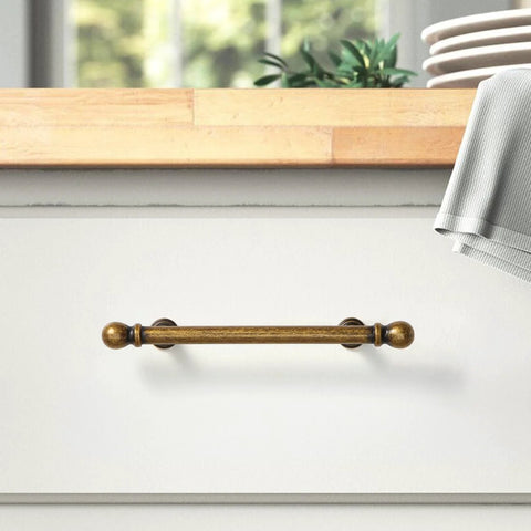 Antique Brass Drawer Pull on white dresser, solid zinc, aged bronze finish, 3-3/4 inch center, part of set of 10 handles