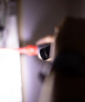 Person using 2 Cell CR123 LED Tactical Flashlight With QuickClick Modes Water Resistant Plain Bezel Black Aluminum Body