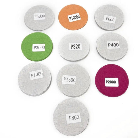 Grab This Awesome 50 Pc Set Of 3 Inch Wet Dry Sanding Discs With Latex Flocking For Perfect Polish And Grind Jobs Ranging From Grit 320 To A Smooth 10K Finish On Your Tools, showing assorted grit numbers on discs.