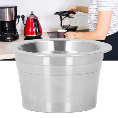 Premium reusable coffee pod made of stainless steel for CaffeItalia machines, shown with brewing setup on kitchen counter.