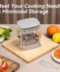 Badelite 3-in-1 vegetable cutter with stainless steel blades, clear housing and gray lid, front view on a wooden board.