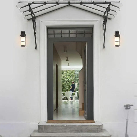 Outdoor E27 Wall Light LED Sconce With Glass Waterproof Lantern for Patio, Rustic Modern Design beside doorway
