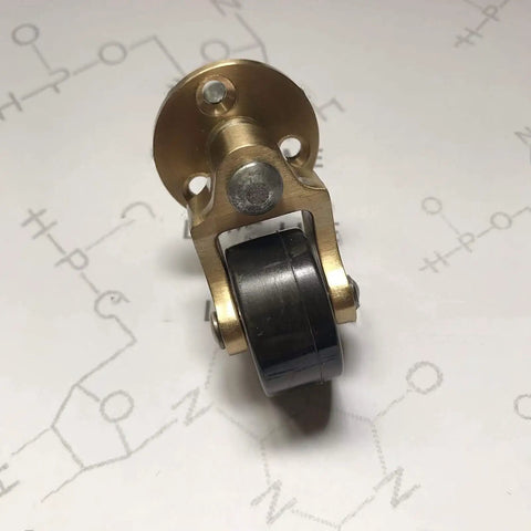 Built Ridiculous Solid Brass Casters, 1 Inch Swivel Wheel Casters With Heavy Duty Screw Stem, Nailed It Setup Rolling Hardware For Couches And Cabinets, 4 Pack close up of brass caster with black wheel.