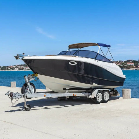 Boat on a trailer featuring 2 Pack 4.80-12 Trailer Tires On 12 Inch Rims With 5 Lug On 4.5 Inch Bolt Pattern 2.95 Inch Center Bore