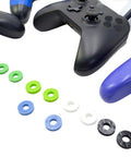 Ten Pack Controller Aim Assist Rings For Thumbsticks With Sponge Motion Control Grips shown with gaming controllers