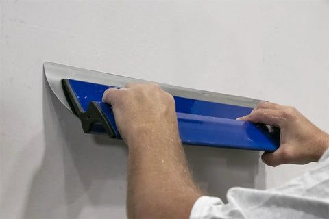 ProSkim 24 Inch Drywall Tool For Ultra Smooth Finish Lightweight Skimming Blade Set Ergonomic Non Slip Handle Perfect For Plaster And Drywall Finishing Made In USA SKIM60 being used on wall
