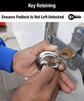 Hands using Stainless Steel Discus Padlock With Key Two And Three Quarter Inch Wide 40DPF Weather Resistant for trailers