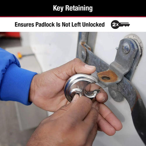 Hands using Stainless Steel Discus Padlock With Key Two And Three Quarter Inch Wide 40DPF Weather Resistant for trailers