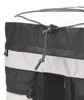 Close-up of black and white 60L Bike Trunk Bag with Rain Cover for Mountain Bikes, showcasing strap and material details.