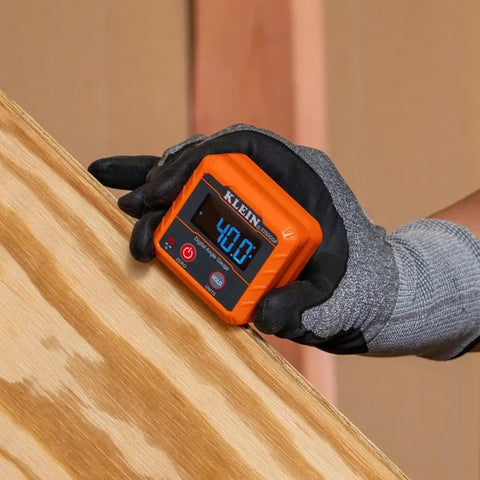 Gloved hand holding an Angle Finder Digital Gauge With Strong Magnetic Base For Quick Conversions Between Degrees, showing 40.0 degrees.