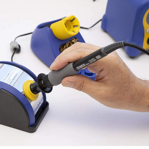 Lightweight Soldering Iron With T18-B Tip For Electronics, 26V 65W Ceramic Heater in use with temperature control station.