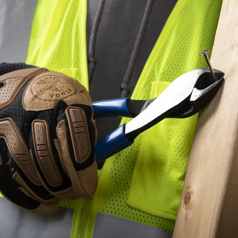 8 Inch Diagonal Pliers With Angled Head And High Leverage For Confined Spaces Cut ACSR Screws Nails And Hardened Wire Made In USA Delivering 36 Percent More Cutting Power With A Rugged Angled Head For Tight Spaces used by gloved hand to pull nail from wood